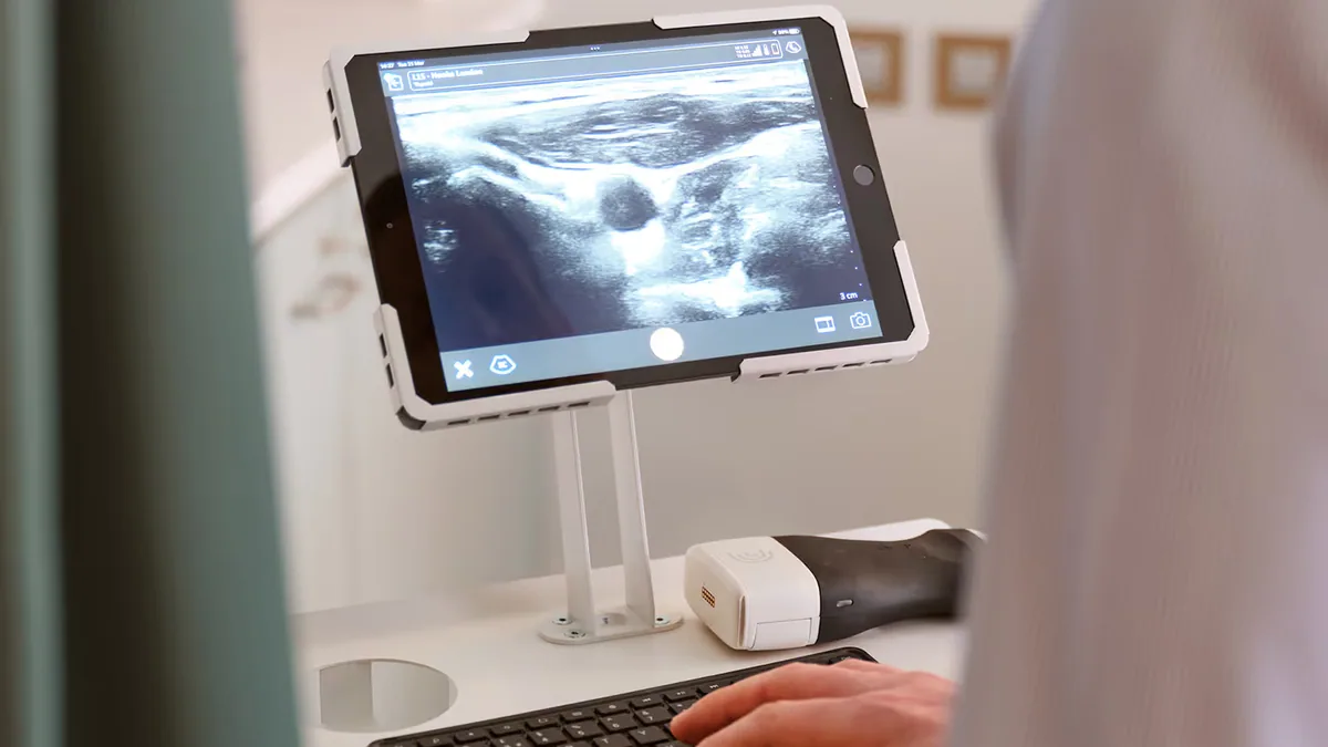 HOOKE doctor reviewing a patient's ultrasound scan