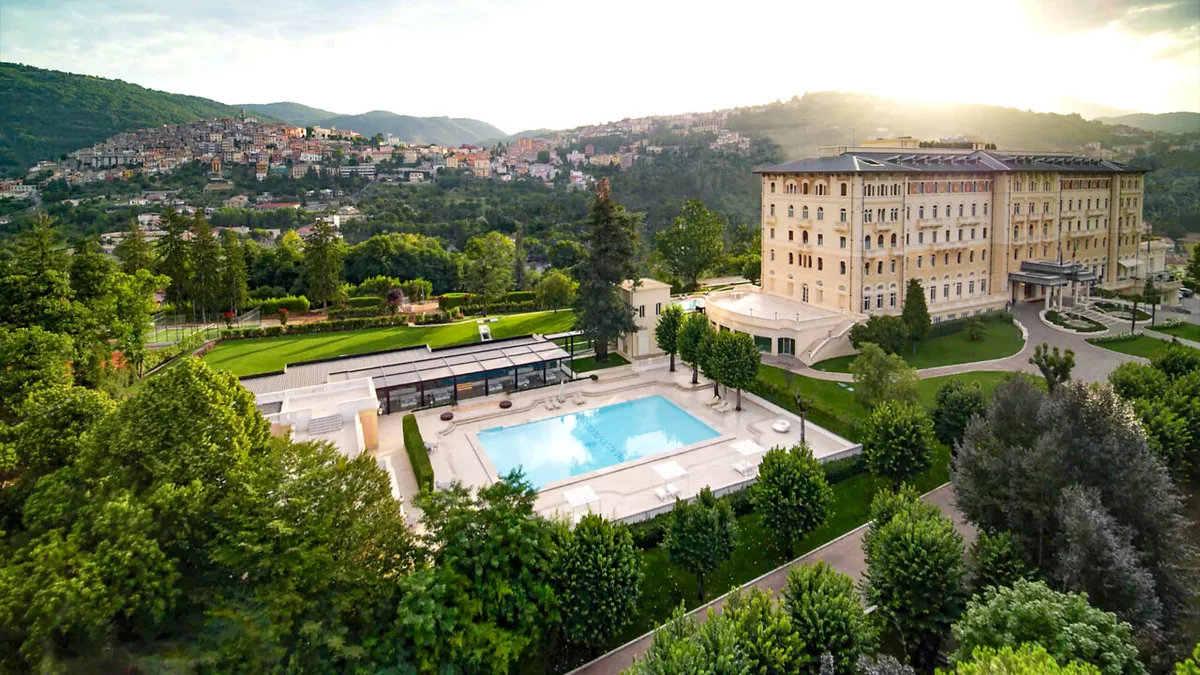 Aerial view of Palazzo Fiuggi, its grounds and outdoor pool