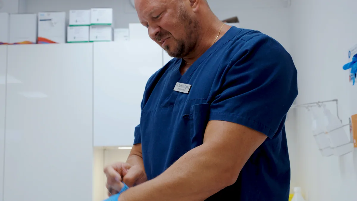 Clinician preparing a regenerative treatment at SLS in Stockholm